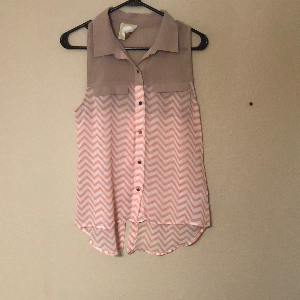 Peach and tan colored sleeveless button up shirt